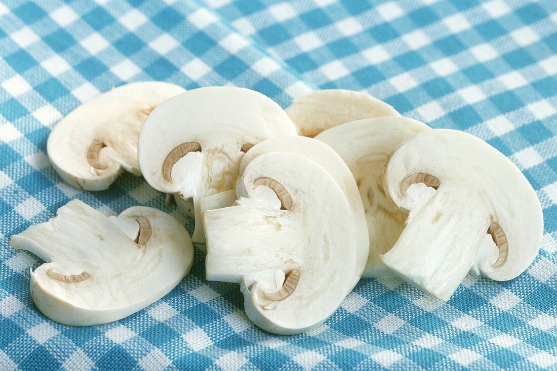 Mushroom slices on checked cloth