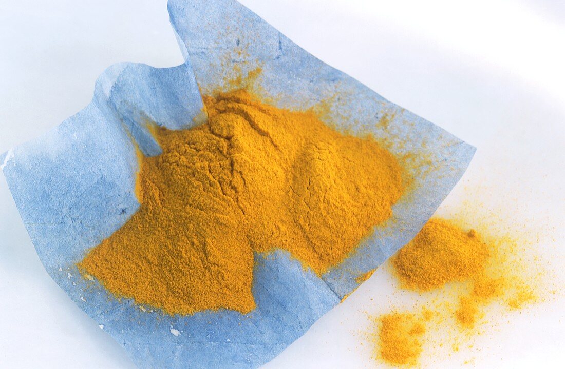 Turmeric on blue paper