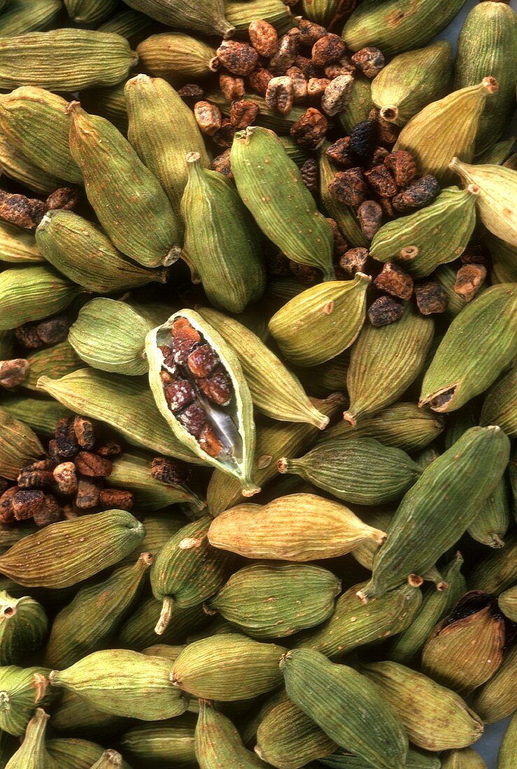 Cardamom capsules and seeds (filling the picture)
