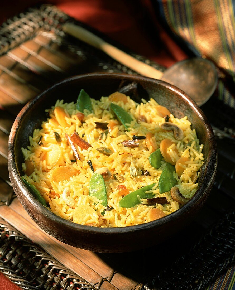 Saffron rice with raisins and mangetouts