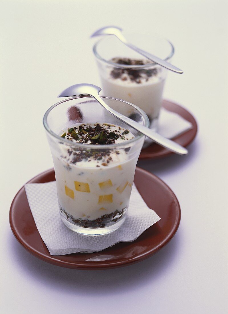 Mango yoghurt with pistachios and chopped chocolate