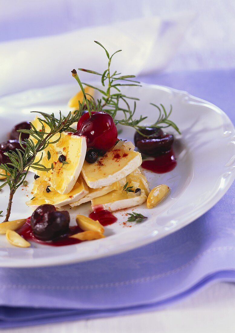 Marinated soft cheese with cherry ragout and rosemary