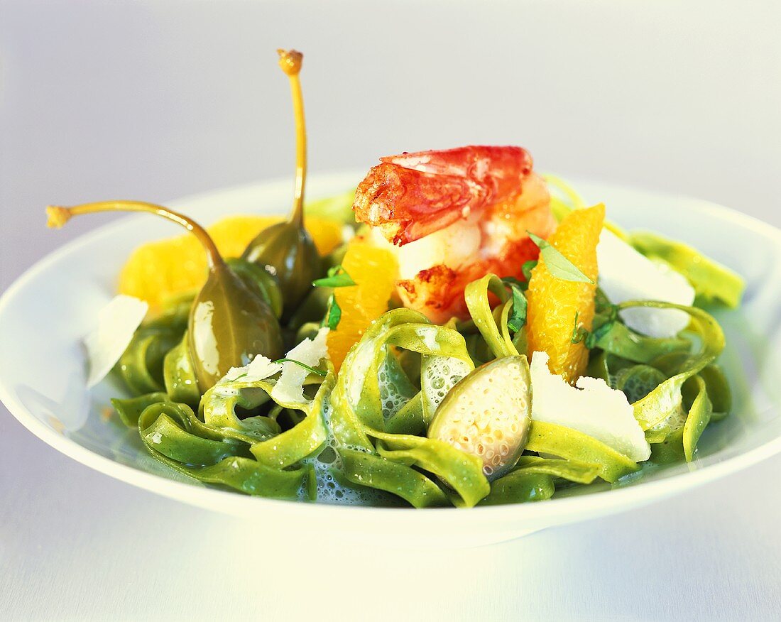 Green tagliolini with shrimps, oranges and capers
