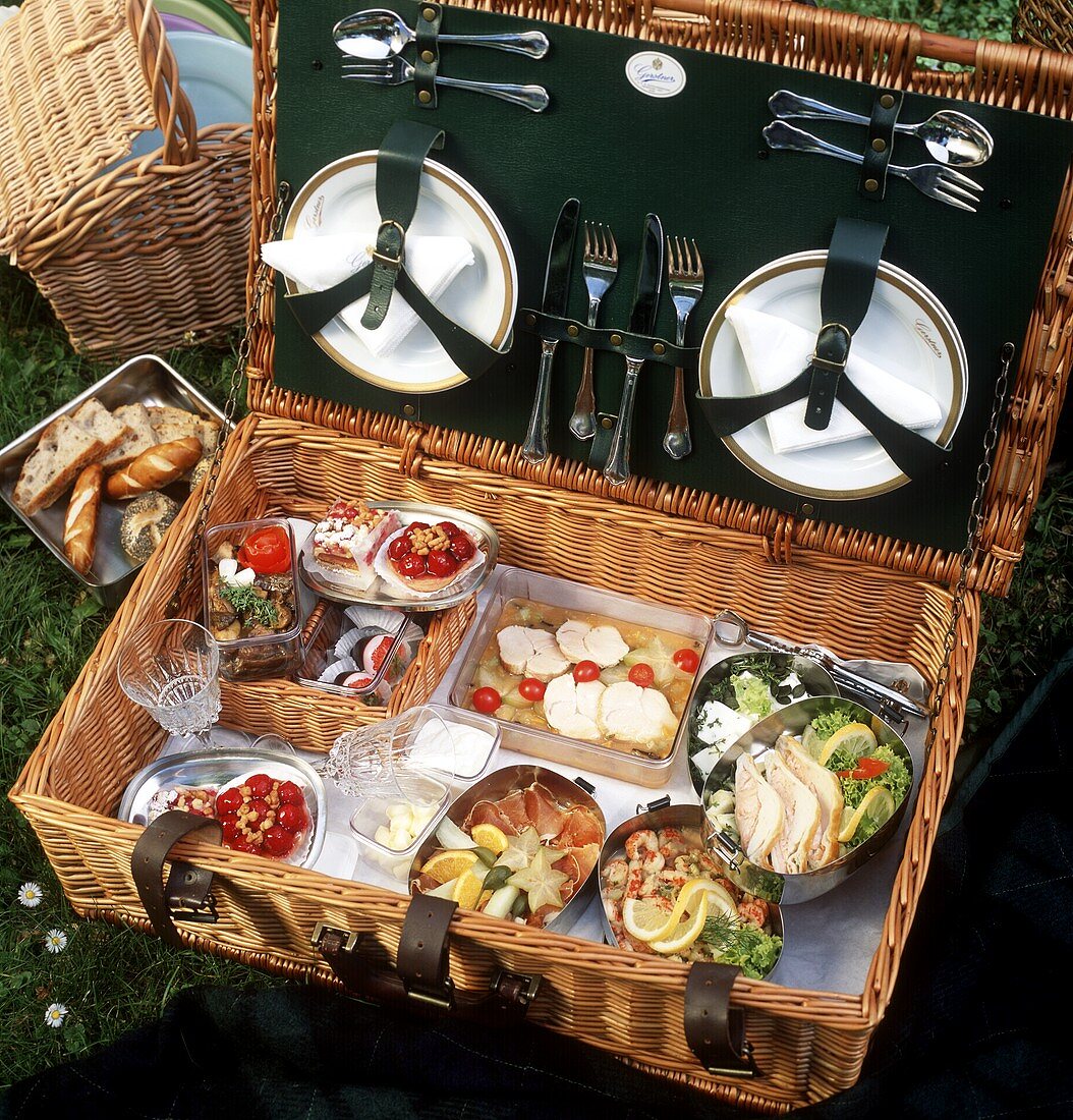 Picnic hamper with various dishes