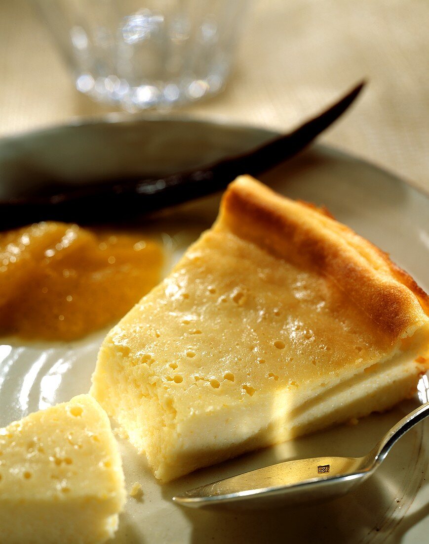 Piece of cheesecake with apricot compote