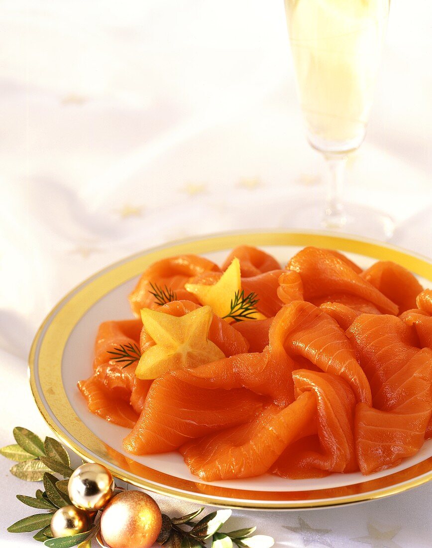Smoked salmon and champagne glass with Christmas decoration