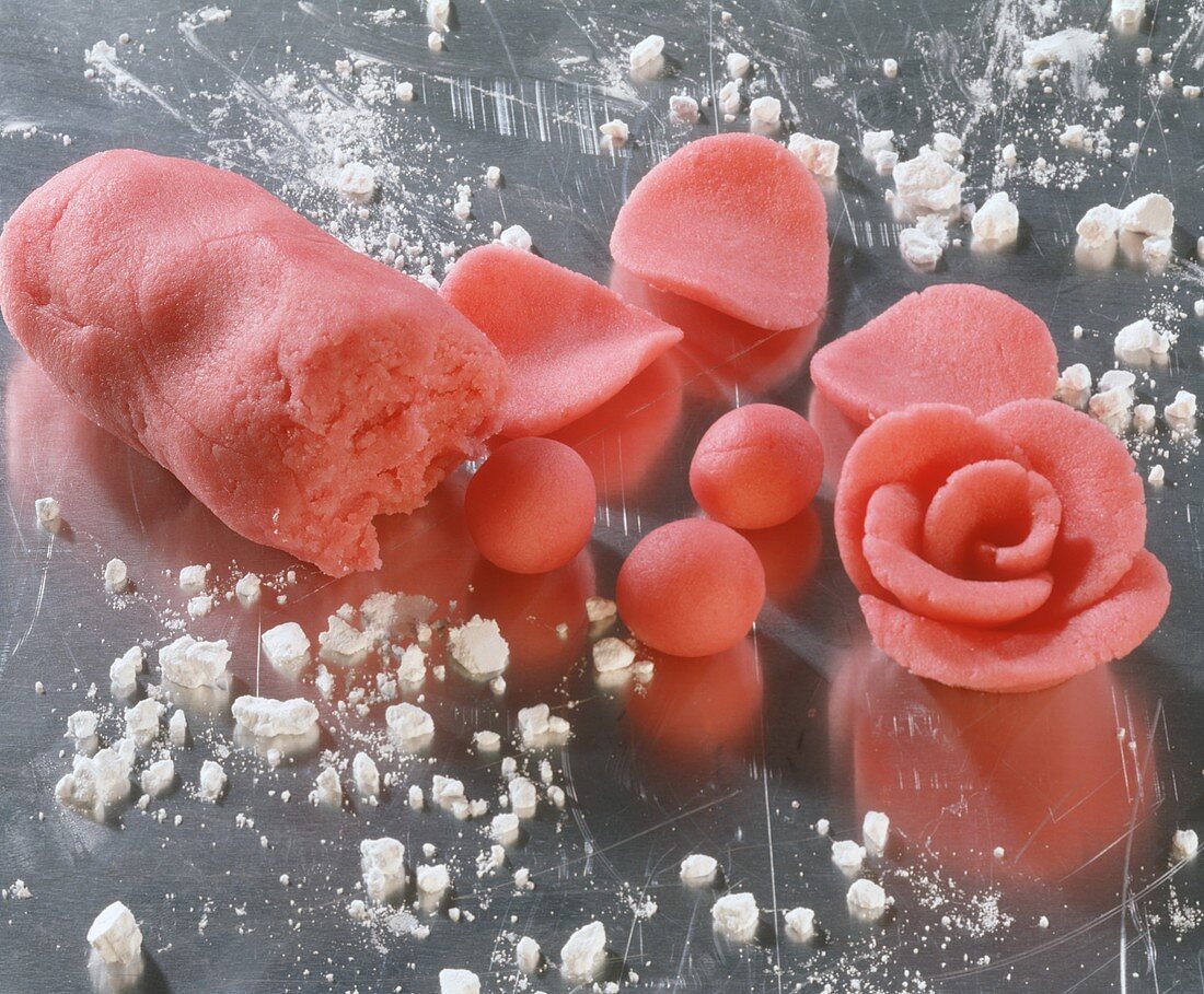 Pink marzipan rose and icing sugar