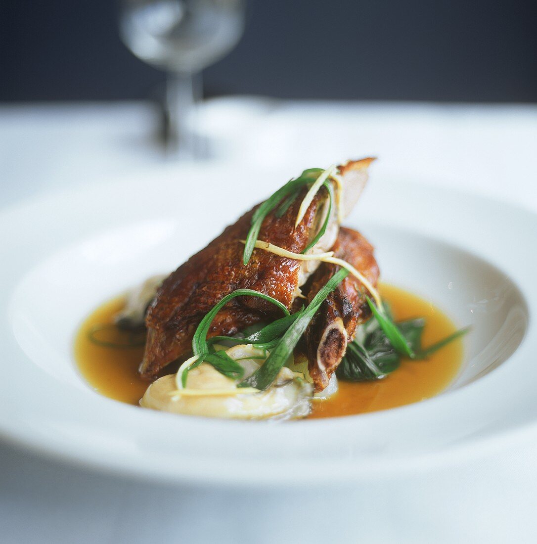 Crispy pork ribs with mashed potato and sauce