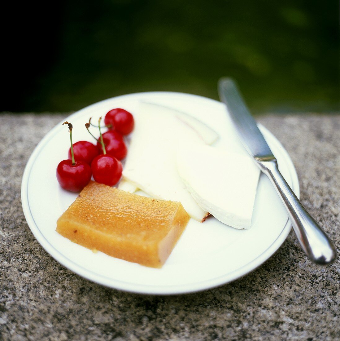 Goat's cheese with quince jelly and cherries