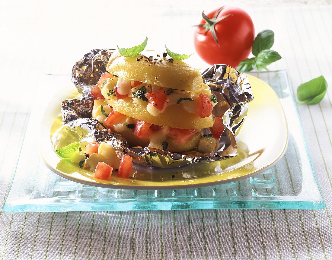 Baked potato with mozzarella and tomato filling