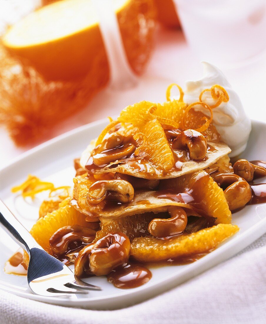Mini-crepes with orange and cashew sauce