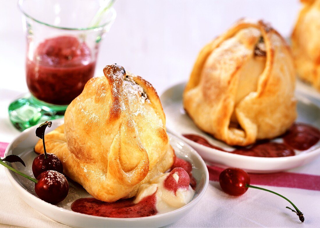 Marzipan apples with cherry sauce