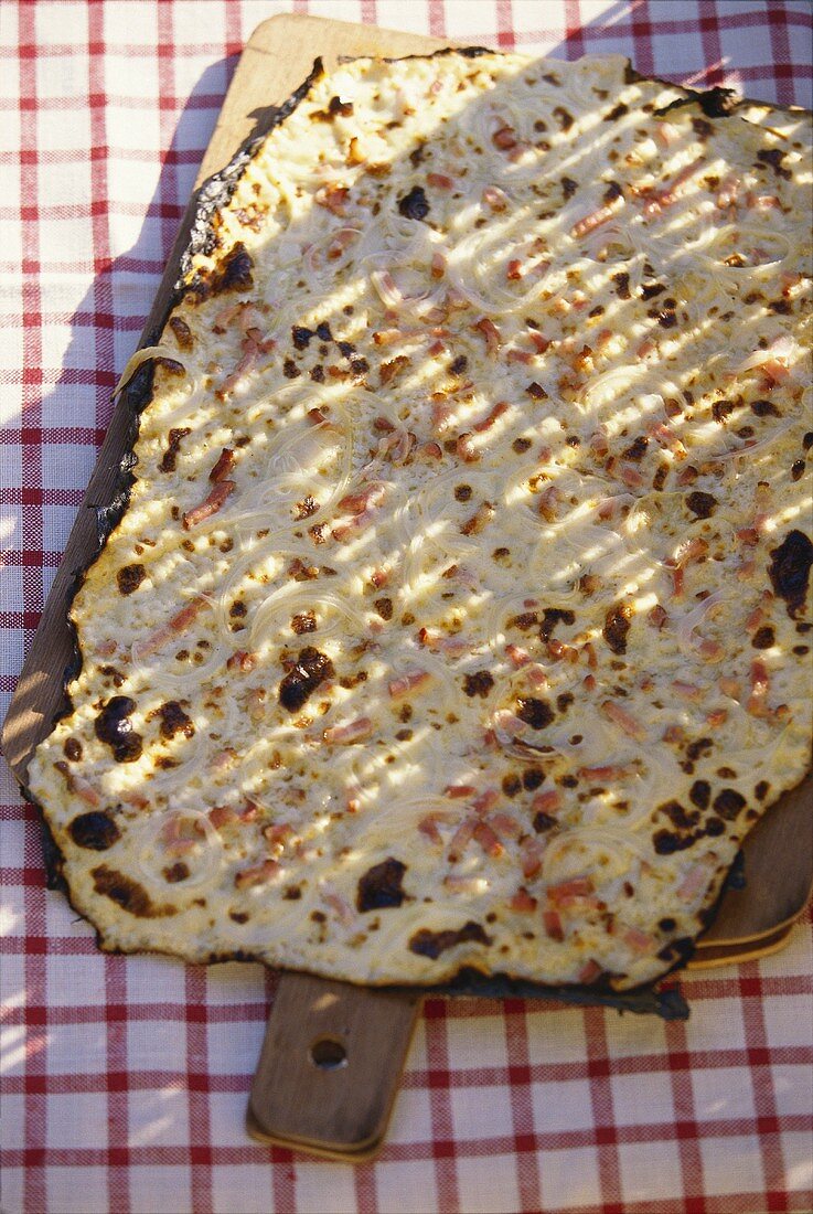Hearty tarte flambée with ham and onions