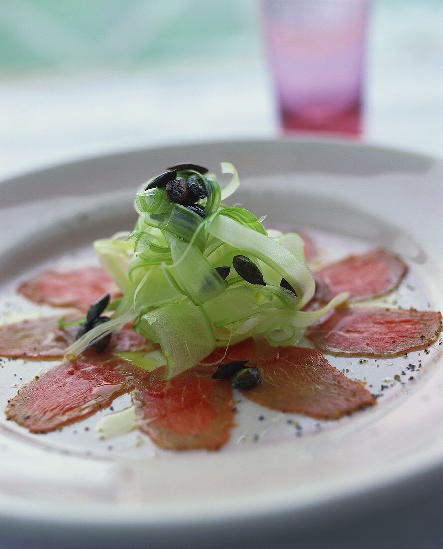 Veal carpaccio with celery and pumpkin seeds