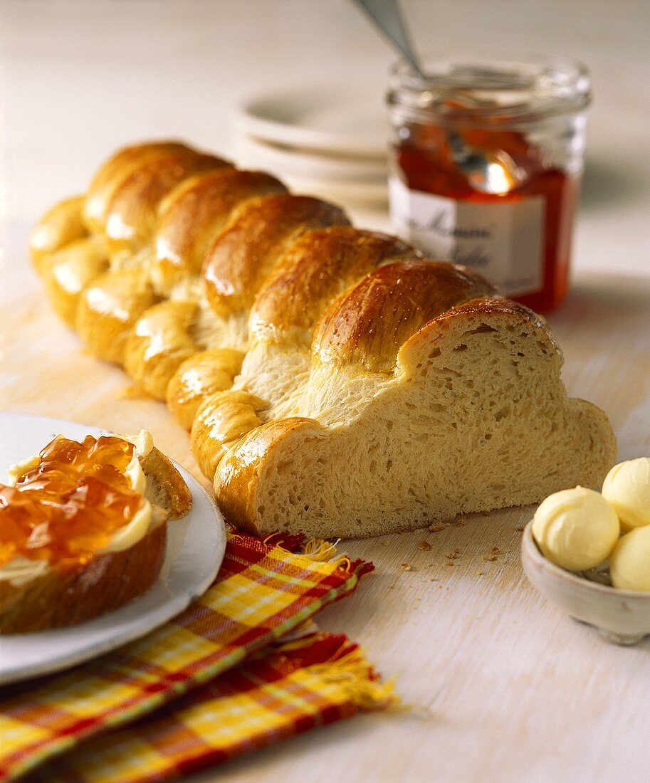 Bread plait with butter and jam