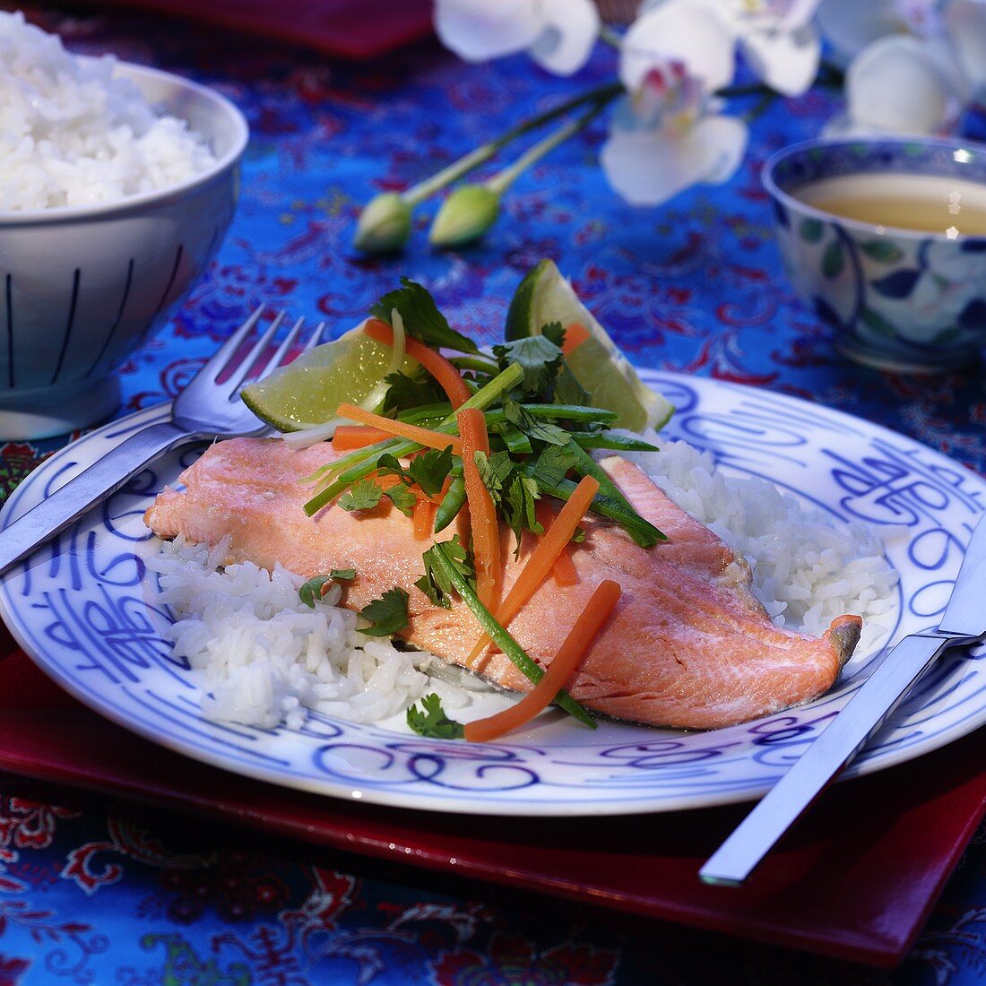 Salmon trout with vegetables, limes and rice