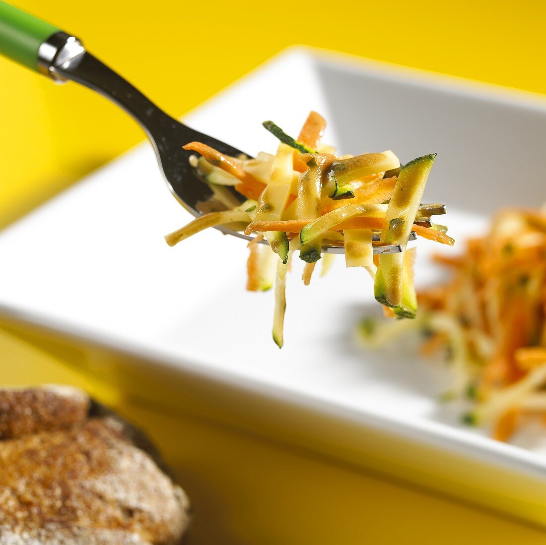 Courgette and carrot salad on fork