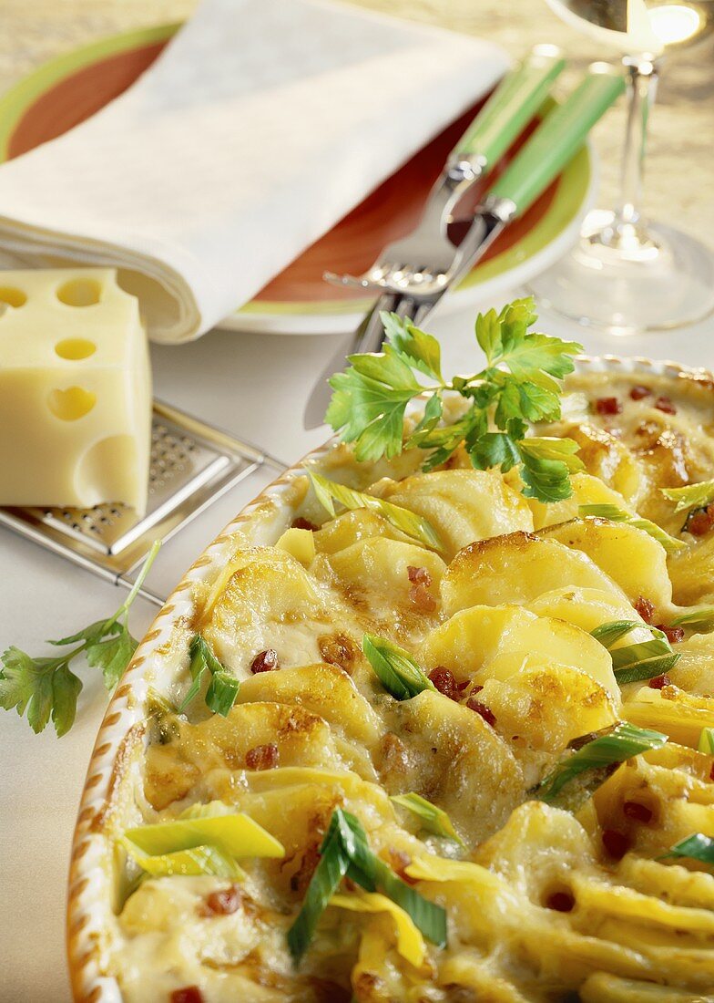Potato bake with ham, cheese and spring onions