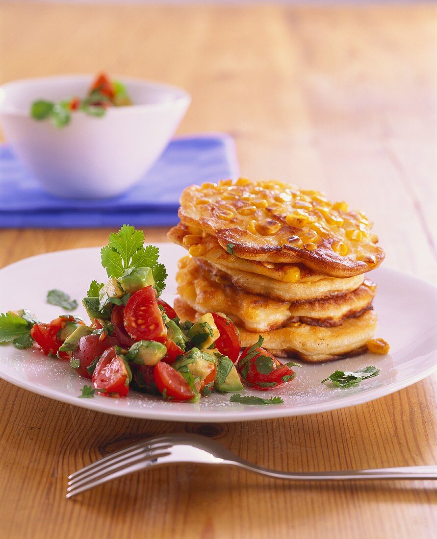 Corn pancakes with tomato and avocado salsa