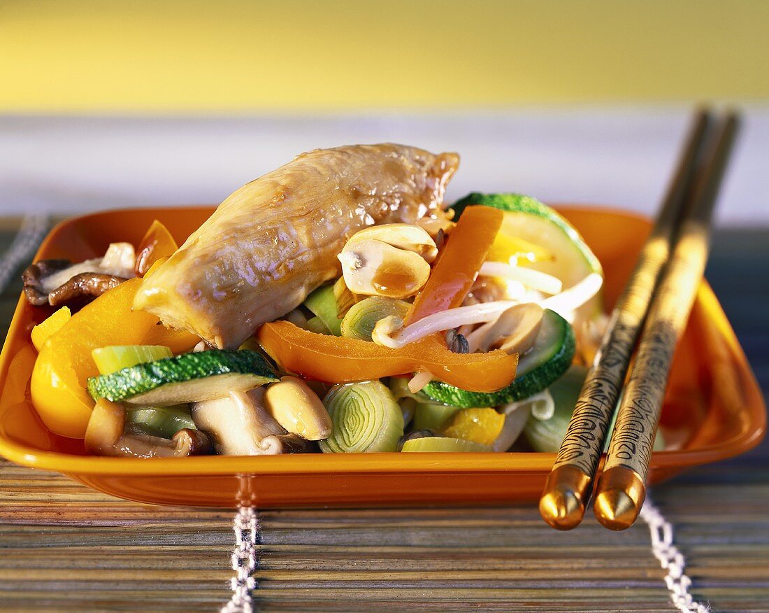 Chicken breast with peanuts and vegetables, cooked in the wok
