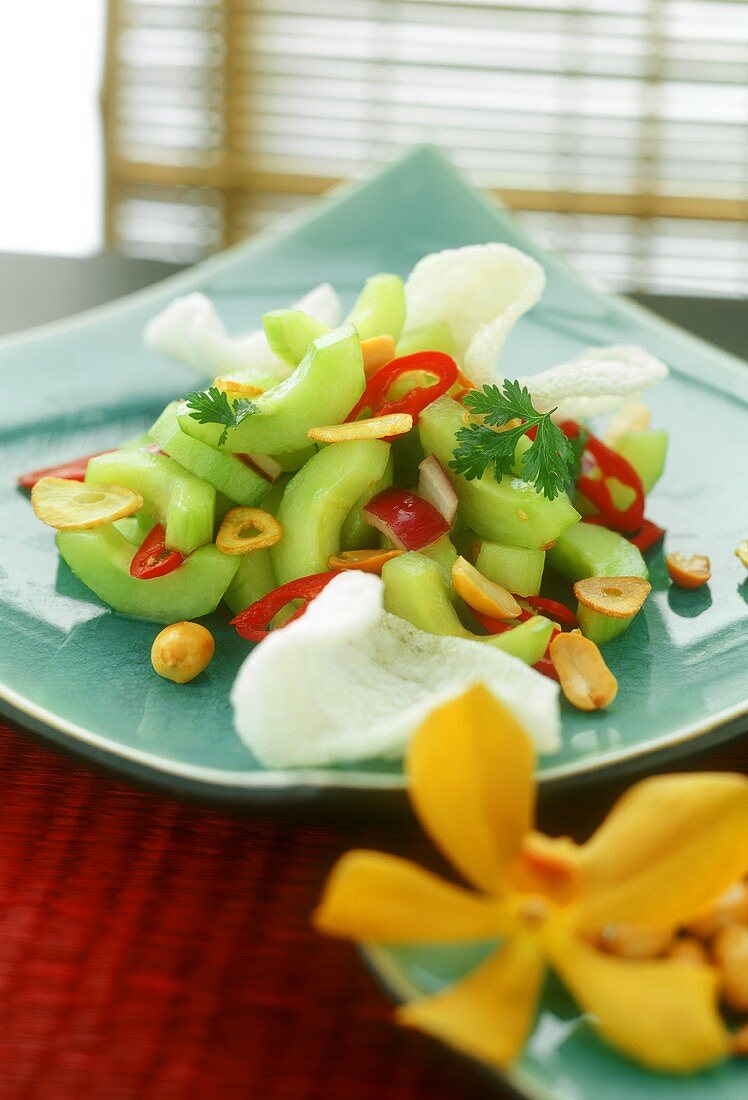Cucumber salad with peanuts and prawn crackers