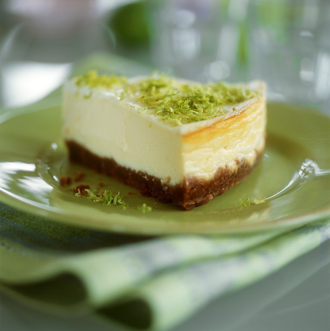 Piece of cheesecake with lime