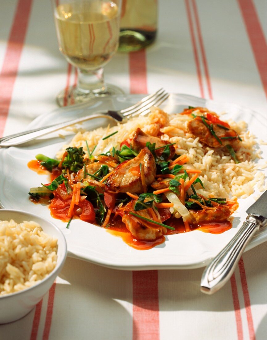 Sweet and sour pork fillet with vegetables and rice