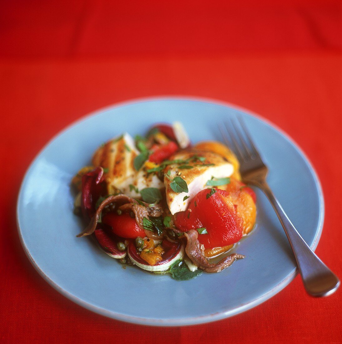 Cold chicken breast on peppers with anchovies