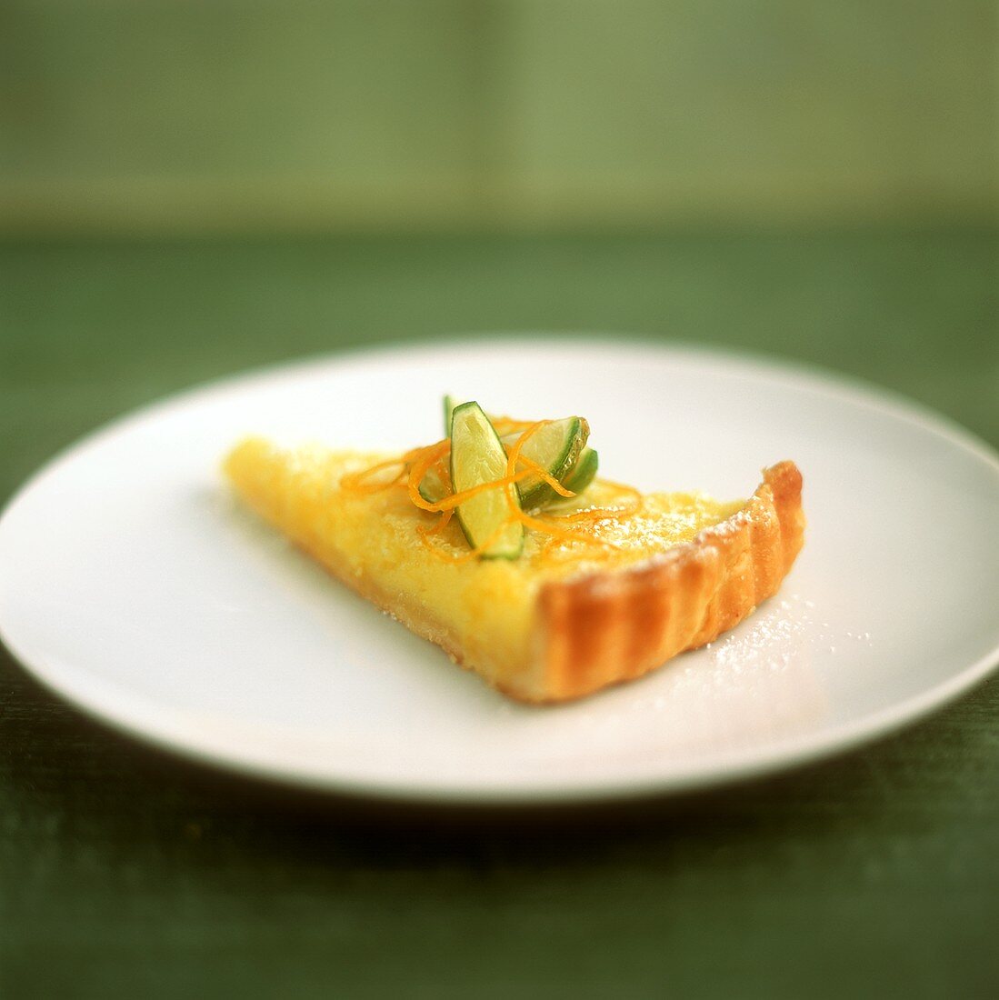 Piece of lime tart on plate