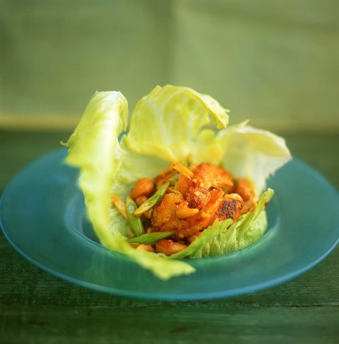 Spicy prawns with cashew nuts in lettuce leaf
