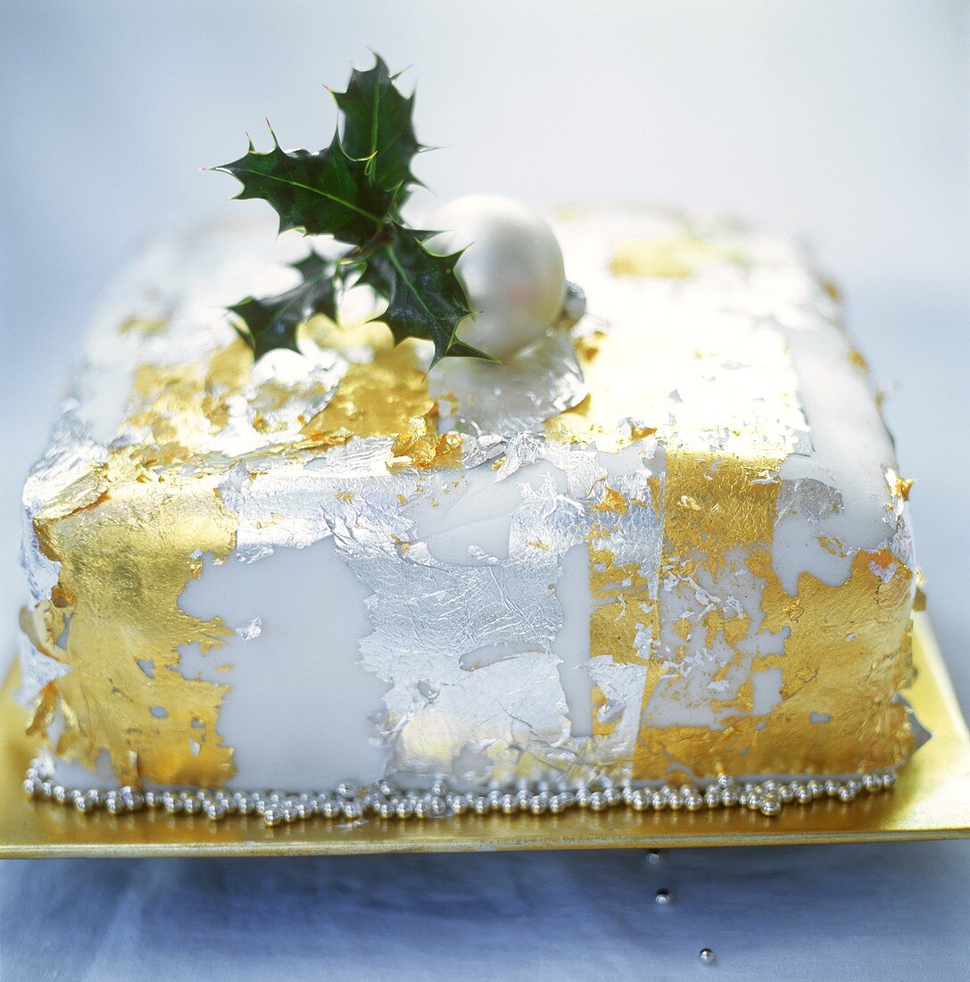 Christmas cake with edible gold and silver leaf decorations
