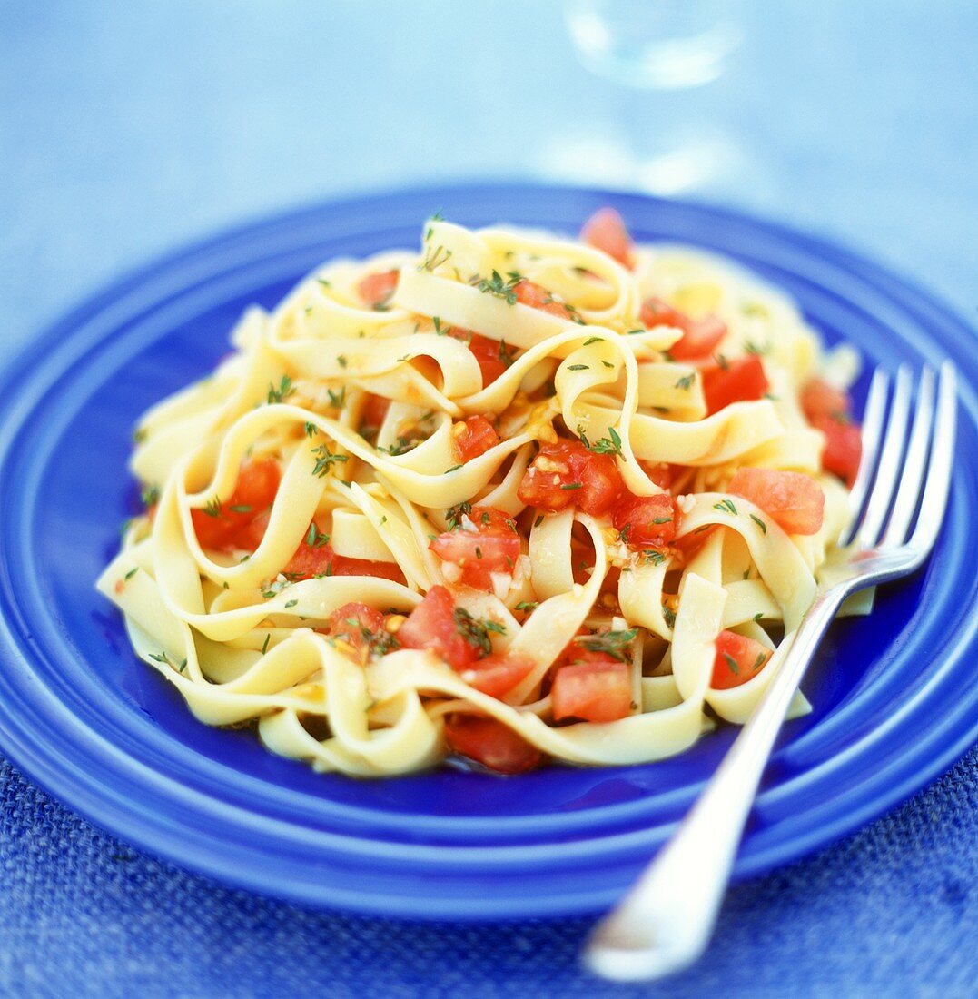 Ribbon pasta with tomatoes and thyme