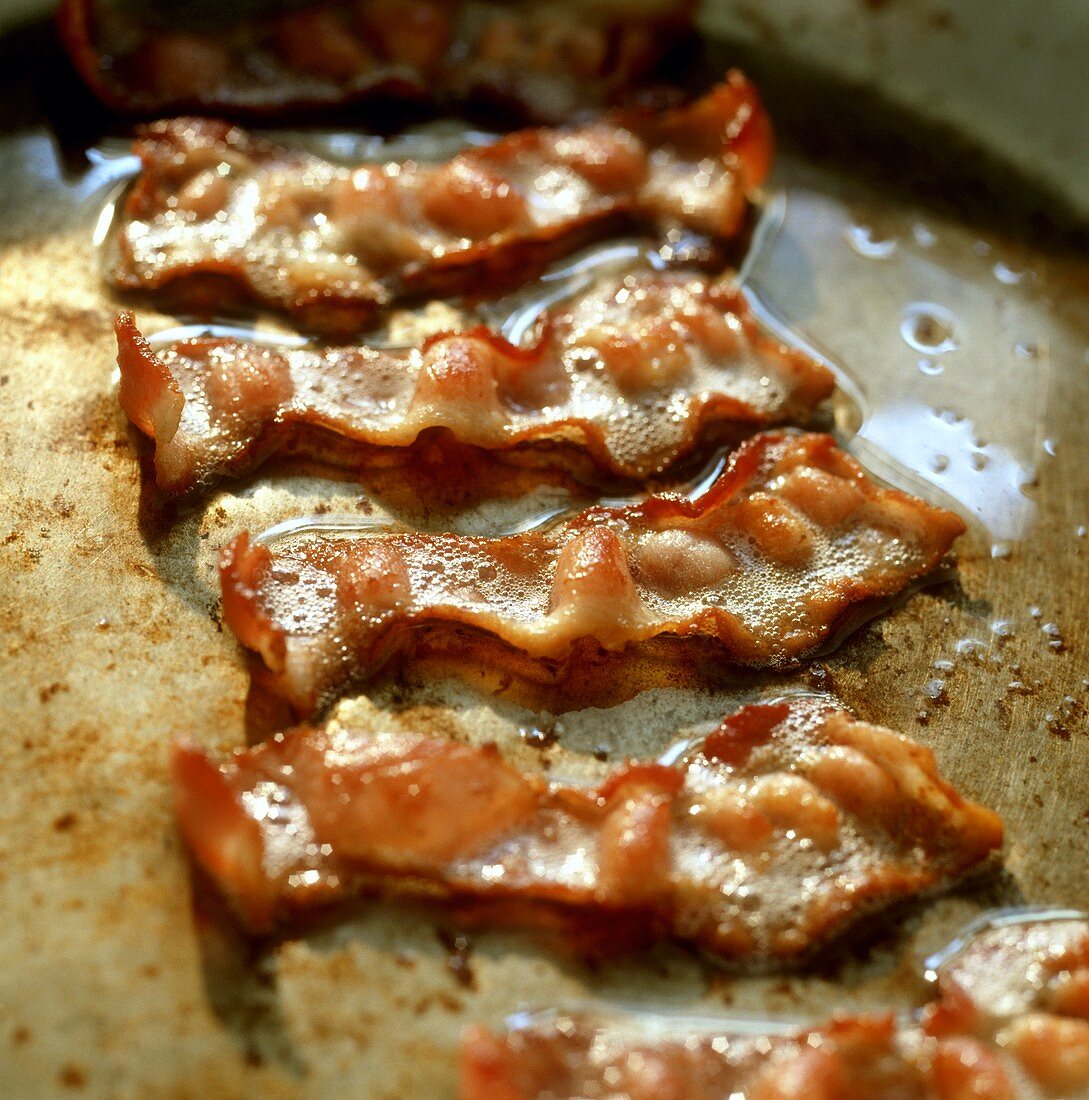 Strips of fried bacon