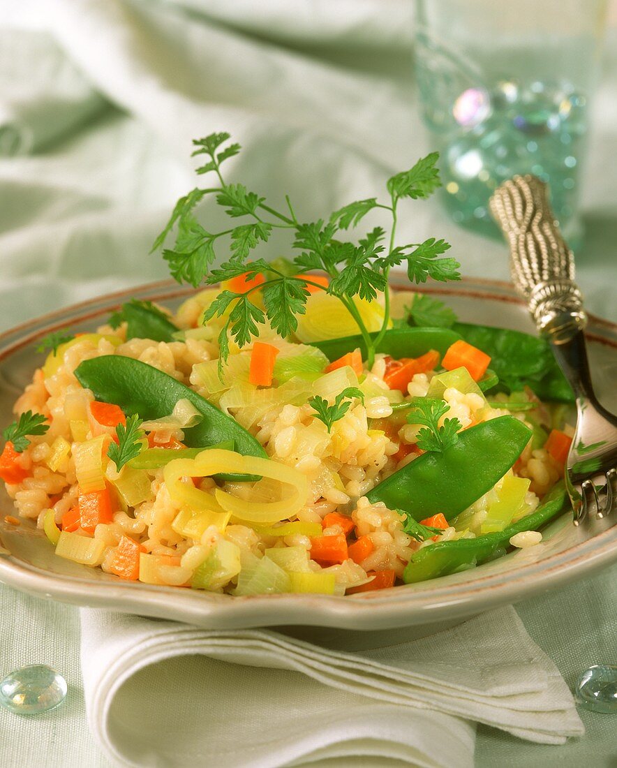 Risotto with leeks, carrots and mangetouts