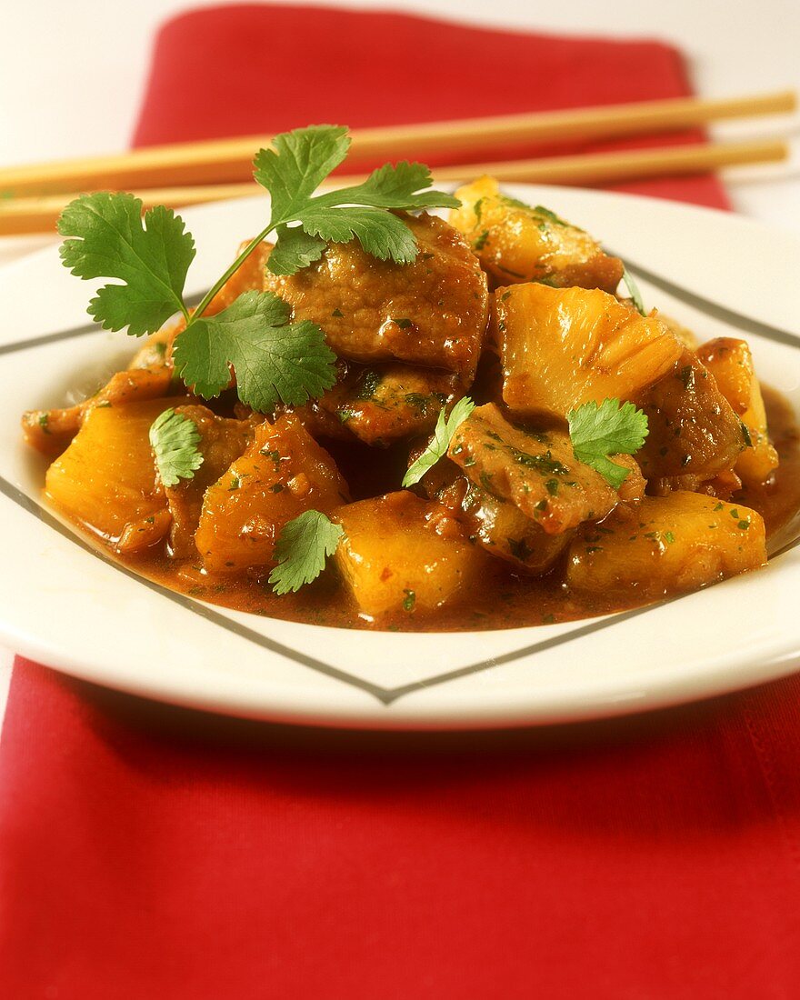 Sweet and sour pork ragout with pineapple