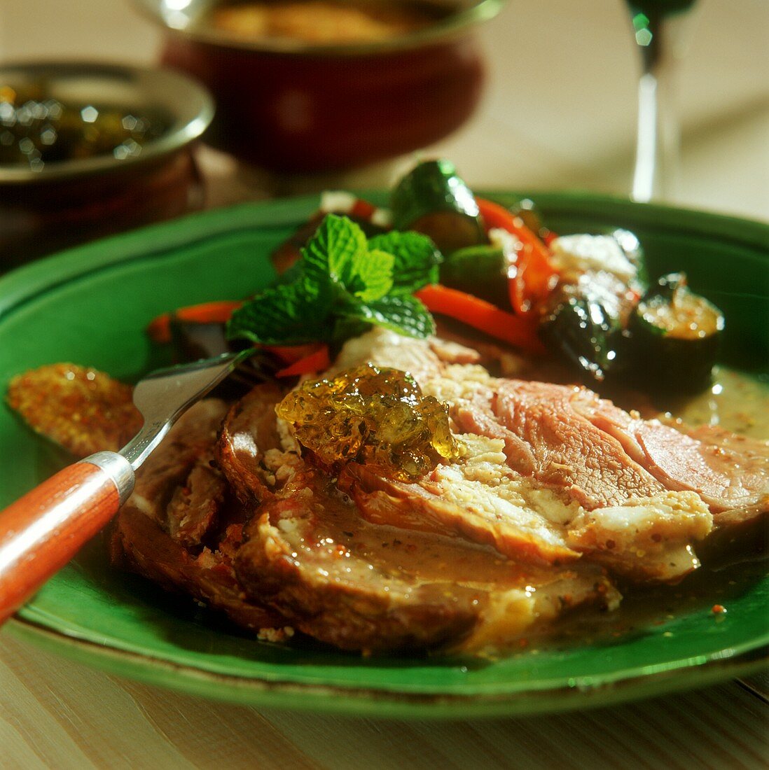 Roast lamb with vegetables and mint jelly