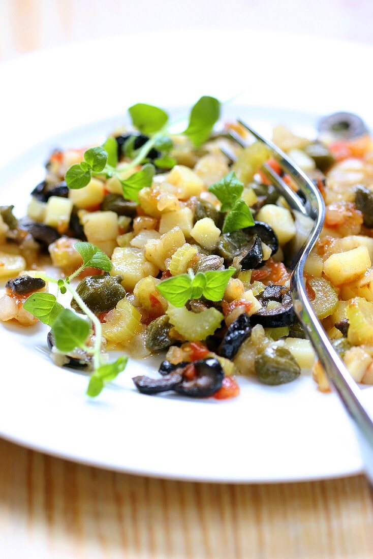 Vegetable salad with olives and capers