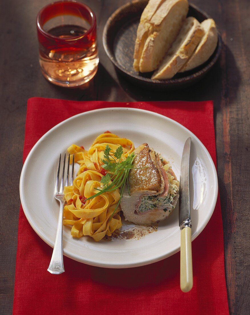 Stuffed chicken breast with ribbon pasta