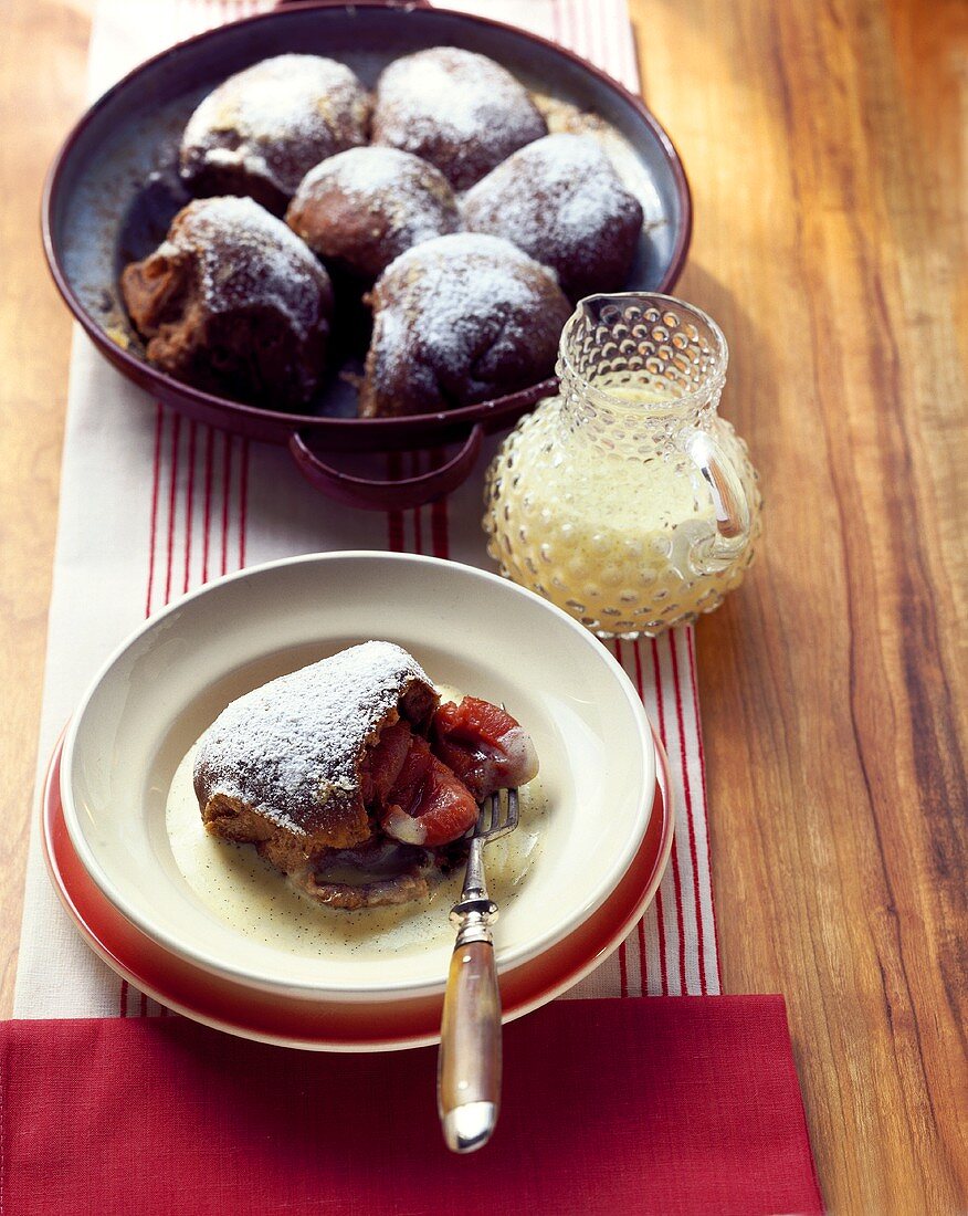 Yeasted chocolate rolls with plums and custard