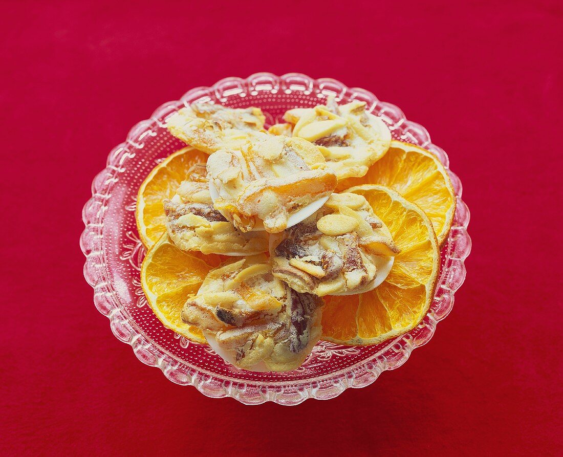 Date and orange biscuits on dried orange slices