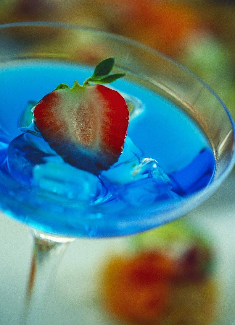 Cocktail with Blue Curacao and strawberry