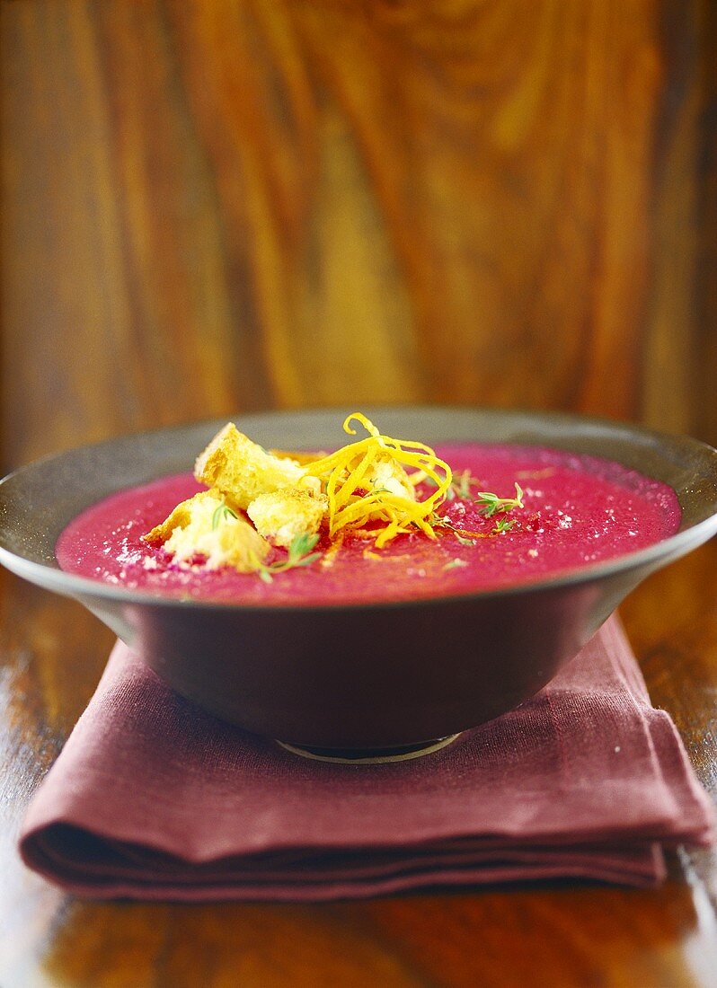 Beetroot cream with red onions, croutons, lemon zest