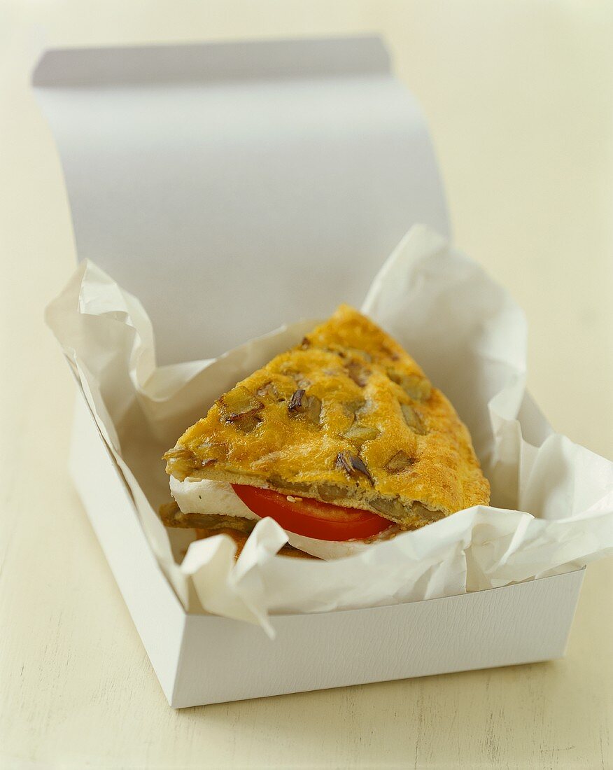 Frittata sandwich with aubergines in box