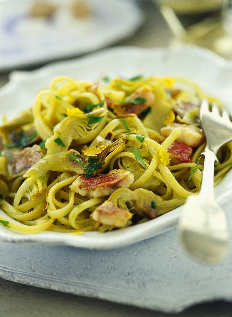 Linguine with fish and artichokes