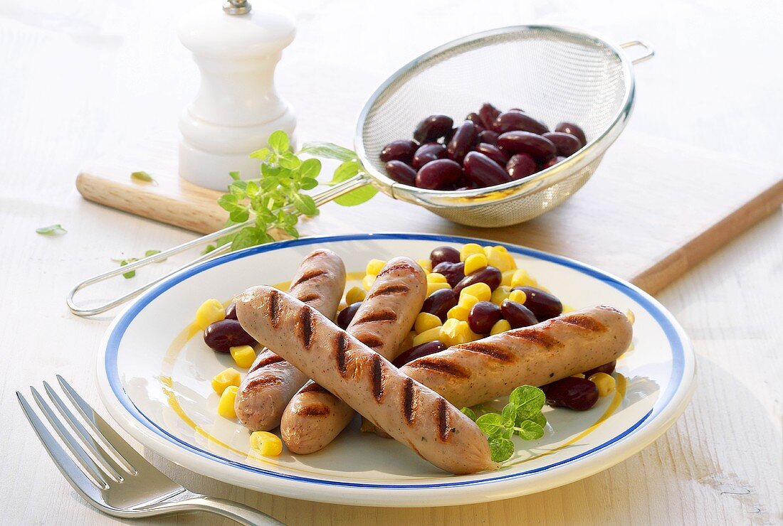 Fried sausages with bean and sweetcorn salad