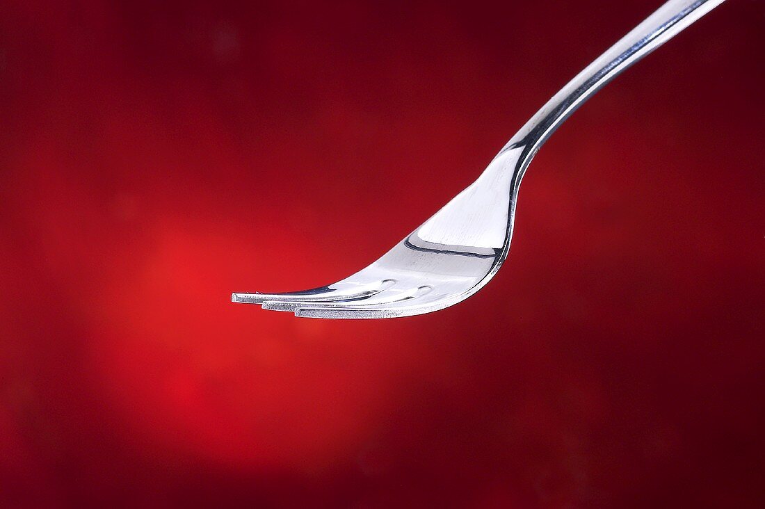 Fork against red background