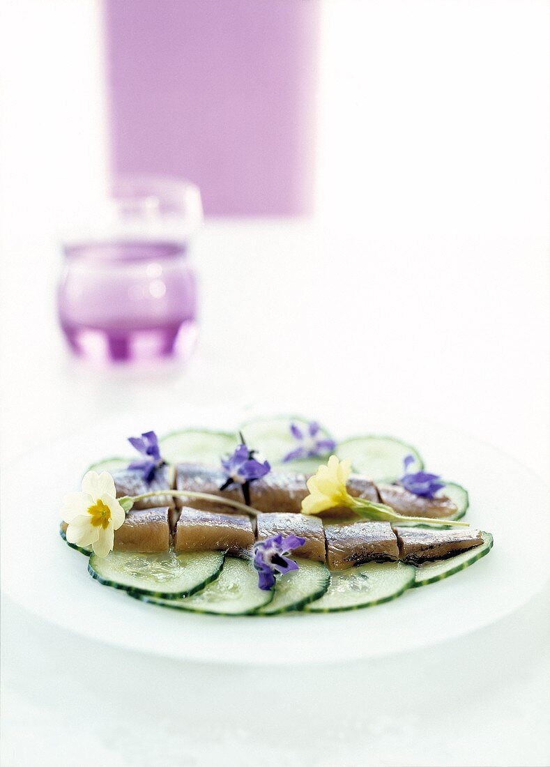 Herring with cucumber and borage flowers