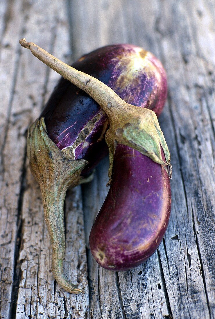 Aubergines on wooden background