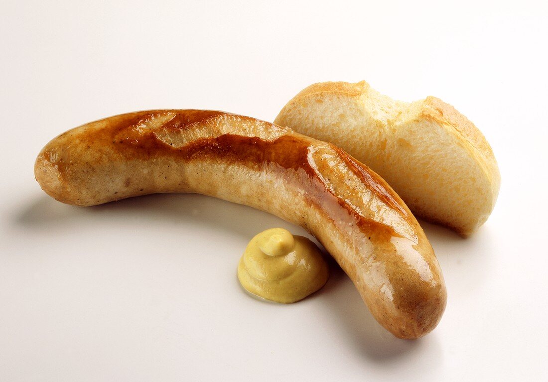 Fried sausage with mustard and white bread