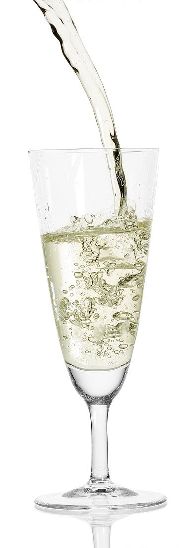 Sparkling wine (Prosecco) being poured into glass